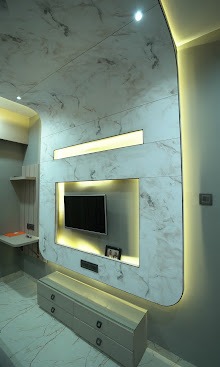 The Curved Marble Canopy & Illuminated Media Console