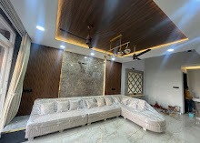 The Teak Canopy & Bookmatched Marble Formal Salon